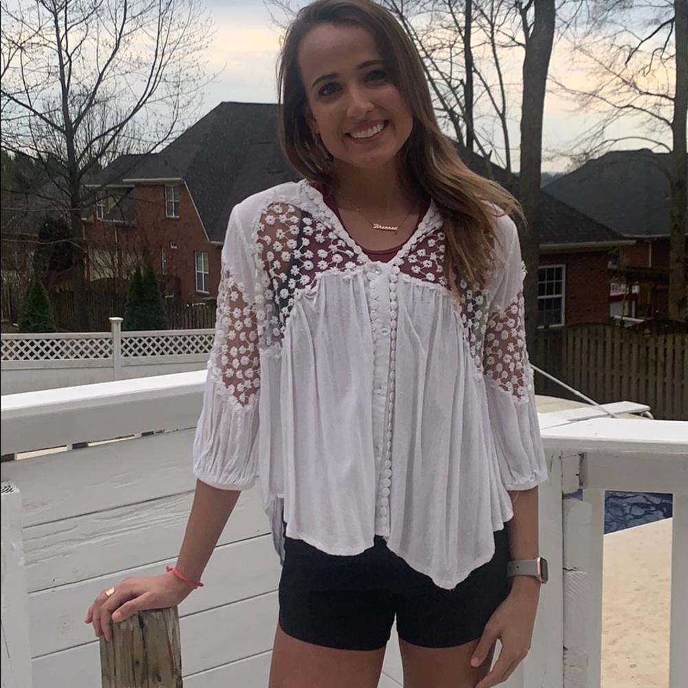 Lightweight white top with shear flower detailing!